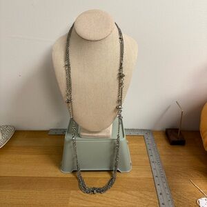 Silver tone multi strand layered necklace with metallic beads